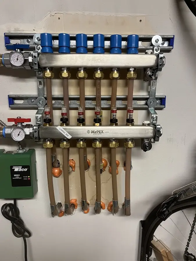 Plumber performing Leak Detection at a residential property in Astoria